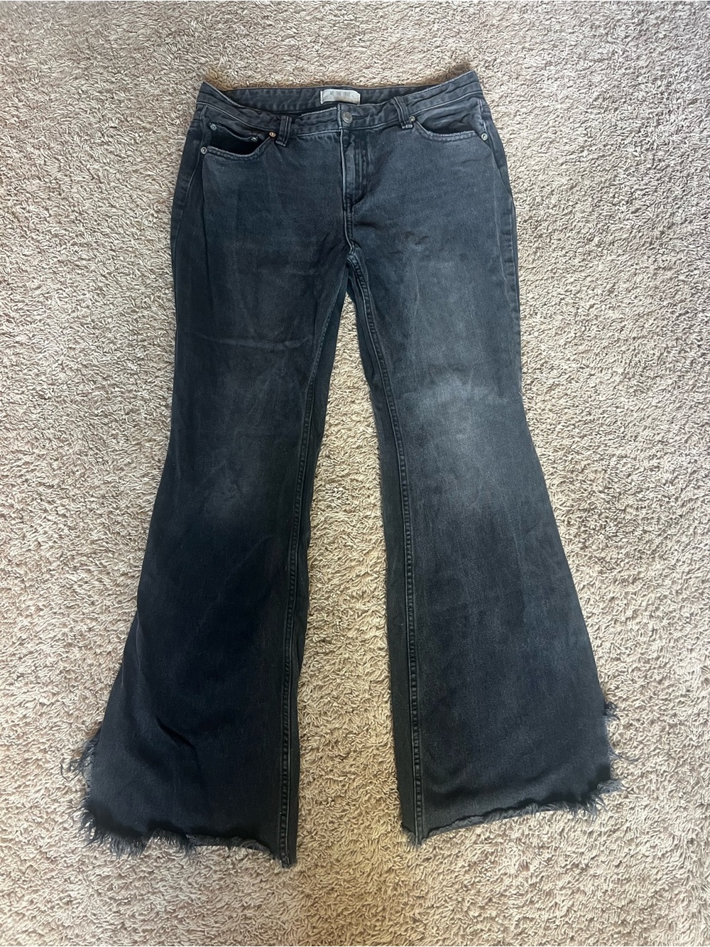 We The Free Washed Black Flare Jeans with Raw Hem